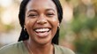 © FryArt - Close-up portrait of young Black woman smiling happily