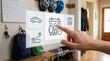 © SYATRI RAWU - Smart Home Digital Interface for Family Planning and Scheduling in a Modern Hallway Interior with Hand Interaction and Logistic Icons