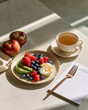 © Benjaporn - Elegant breakfast table with avocado berries boiled egg and herbal tea highlighting metabolic flexibility and morning wellness ritual