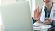 © tippapatt - Female doctor using laptop for patient's online consultation or web conference, telemedicine concept