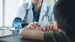 © tippapatt - Female pediatrist doctor reassuring her young boy patient at medical clinic. healthcare and medicine concept.