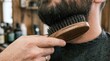 © Panca - Grooming a Man's Beard with a Wooden Brush, a Close-Up Detail of Men's Personal Care Routine