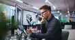 © Andrey Popov - Young Architect Studying 3D Building Model