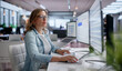 © Andrey Popov - Young Corporate Woman Sending Important Emails