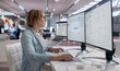 © Andrey Popov - Woman Using Laptop To Review Employee Salary