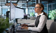 © Andrey Popov - Young Compliance Officer Analyzes Regulatory Data On Laptop