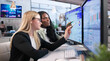 © Andrey Popov - Marketing Manager And Client Discuss Customer Data