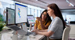 © Andrey Popov - Project Manager Leads Diverse Team Updating Agile Schedule