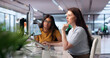 © Andrey Popov - Two Women Examine Subscription Billing Dashboard Using Computer