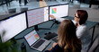© Andrey Popov - Two Women Managers Discuss Financial Data On Laptop