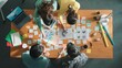 © InfiniteFlow - Top view of business team write graphic logo on meeting table with colorful sticky notes and design while explain idea. Project manager sharing idea and explain concept art to smart team. Symposium.