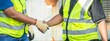 © BESTIMAGE - Two engineers wear safety vest shaking hands in rail Industrial meeting cooperation, engineers team in Construction site handshake Workers for Deal Agreement Partnership in Engineering Field