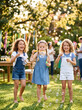 © Ofie - Three Happy Young Girls Blowing Soap Bubbles In A Sunny Garden Party
