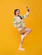 © NaMong Productions - Young Asian woman taking smartphone selfie while celebrating expressing social media lifestyle confidence happiness digital connection personal branding and youthful online engagement.