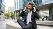 © Ruby - A young business man entrepreneur dancing and listening to music