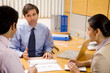 © IndiaPix - Business executives having a discussion