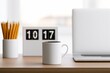 © Wini - Wooden desk with coffee, pencils, flip clock and laptop