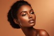 © nsit0108 - Studio portrait of a young black woman with gold makeup and elegant hairstyle, showcasing beauty and skincare