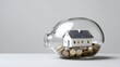 © Nart - A detailed house model rests inside a transparent piggy bank filled with coins. This ultra realistic image highlights financial savings and smart property investment concepts.