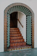 © Ashley - Colorful tiled entrance to a front door located at the top of a staircase.