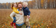 © GuGul - Joyful family moment. Son hugs father kids smile Autumn colors golden light. Warmth park nature Parent care trust man love Meadow field leaves, fall season people joy Boy youth active day fun dad hour