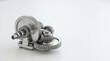 © OPP-786 - Mechanical gear drivetrain for sustainable energy research featuring precision steel cogwheel assembly with polished industrial detail and clean