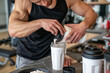© lashkhidzetim - Muscular man pours protein shake into blender. He leans forward, focused on preparation. Setting in gym with fitness gear nearby. Ideal for health, nutrition, or workout themes