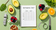 © MDAbdus - Healthy eating flatlay avocados berries citrus and a recipe notebook