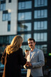© Zoran Jesic - Business colleagues networking during coffee break outdoors