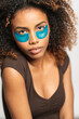 © Gonzalo Infiesta - Young woman applying under eye patches for skincare routine