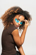 © Gonzalo Infiesta - Young woman applying under eye patches for skincare