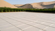 © twc - Solar panels array in a desert oasis landscape with sand dunes and green vegetation in the background under clear blue sky during daylight