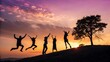 © Imran - Diverse group of happy friends jumping on a hill at sunset for a joyful outdoor celebration.