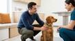 © OlgaNeuroArt - Man visiting veterinary clinic with golden retriever. Male pet owner kneeling next to dog during appointment with female veterinarian
