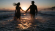 © BlackBridge Media - Couple Holding Hands Walking in Ocean at Sunset