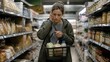 © A Gee Nomo - A concerned woman holding a shopping basket with a few groceries looks down in a brightly lit supermarket aisle.