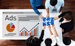 © InfiniteFlow - A diverse team engages in a collaborative advertising strategy session, focusing on charts and puzzle pieces, symbolizing teamwork and innovative marketing solutions. Trope