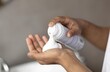 © Prostock-studio - Focused Unrecognizable Person Applying Skincare Foam In Hands At Home, Engaged In Daily Skincare Routine. Creating Smooth Texture Of Product While Preparing For Personal Care At Bathroom.