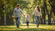 © Bayu - Happy Young Family Walking in Sunlit Park Holding Hands