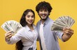 © Prostock-studio - Smiling Young Male And Female Holding Cash Bills With Joyful Expressions, Celebrating Financial Success Together In Studio Setting, Showing Financial Appreciation. Business Concept.