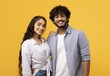 © Prostock-studio - Cheerful Young Couple, Male And Female, Posing Together With Smiling Faces Against Bright Yellow Background. Embracing Happiness And Love, Demonstrating Positive Relationship At Studio.