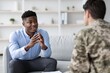 © Prostock-studio - Focused Young Black Man Engaging In Conversation With Soldier During Consultation At Office Setting. Professional Interaction Highlighting Support And Guidance In Healthcare Concept.