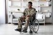 © Prostock-studio - Smiling Black Male Veteran In A Wheelchair, Sitting Confidently In A Modern Indoor Office Setting, Demonstrating Strength And Resilience. Healthcare Concept.