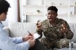 © Prostock-studio - Worried African American Male Soldier Discussing Military Experience With Therapist In Office Setting During Therapy Session. Mental Health And Support Concept.