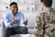 © Prostock-studio - Smiling Black Man In His 30s Engaging In Conversation With Soldier At Office Setting. Both Individuals Appear Happy During Their Discussion, Creating A Positive Business Concept Environment.