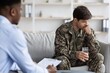 © Prostock-studio - Worried Male Soldier In Uniform Seated In Office, Engaging In Therapy Session With Counselor. Focused On Emotional Wellbeing And Mental Health, Seeking Support And Guidance In Professional Environment