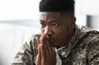 © Prostock-studio - Worried Black Male Soldier Deep In Thought, Sitting Indoors At Home. Displaying Emotion While Reflecting On Personal Matters, Emphasizing Importance Of Mental Wellness And Self-care.