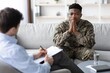 © Prostock-studio - Worried Black Male Soldier Sitting In Office, Engaging In Conversation With Therapist While Seeking Support For Mental Health Concerns. Focus On Emotional Wellness And Counseling Session.
