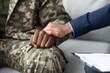 © Prostock-studio - Worried Black Male Veteran Engaging With Supportive Therapist During Counseling Session, Hand Held For Comfort And Reassurance In Calm Office Environment, Focused On Healthcare Concept.