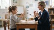 © Thumbs - Teacher teaching sign language to a young student in a classroom